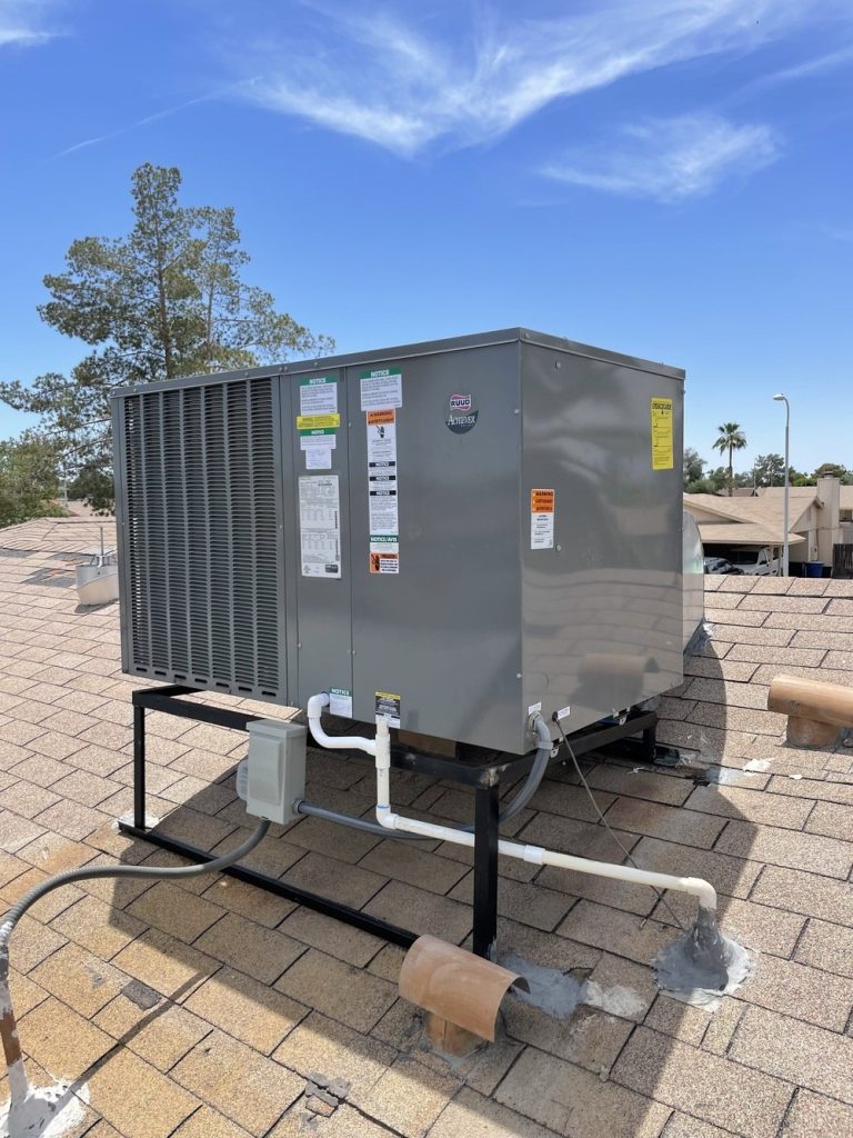 Rooftop package AC and heat pump unit installed on a home's roof